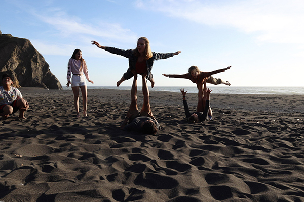 Gr 8 students do yoga at the beach