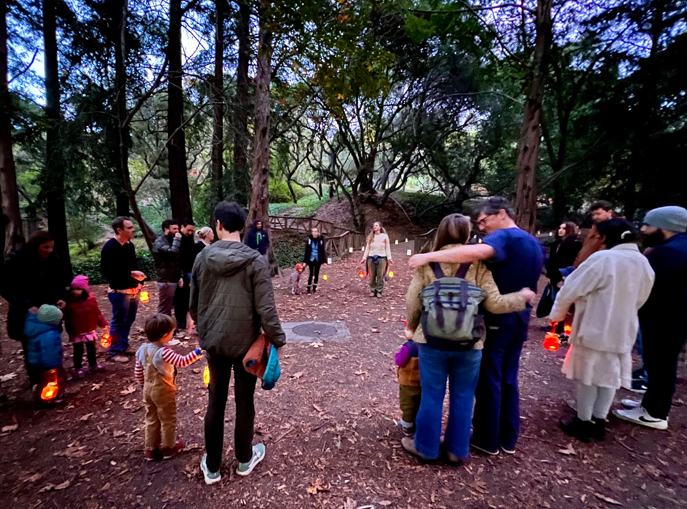 Berkeley Rose families gather at dusk for a lantern walk