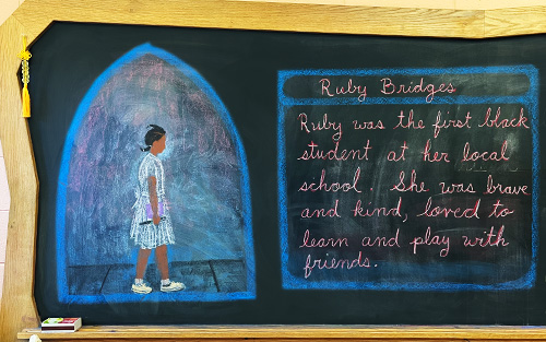Chalkboard drawing of Ruby Bridges and her story